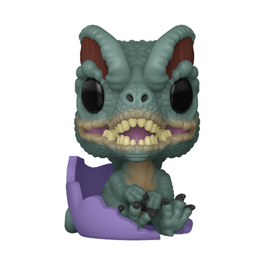 Toy figure of a creature with large eyes and sharp teeth on a white background