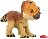 Toy dinosaur figure with a red button on a white background