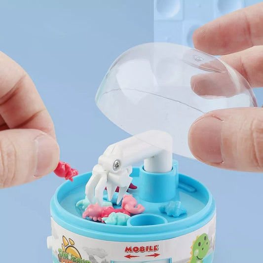 mini dino claw machine on a white background