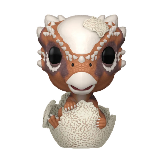 Dinosaur-like figurine hatching from an egg on a white background