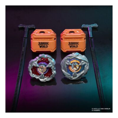 Two toy spinners with 'Jurassic World' branding on orange containers against a dark background.