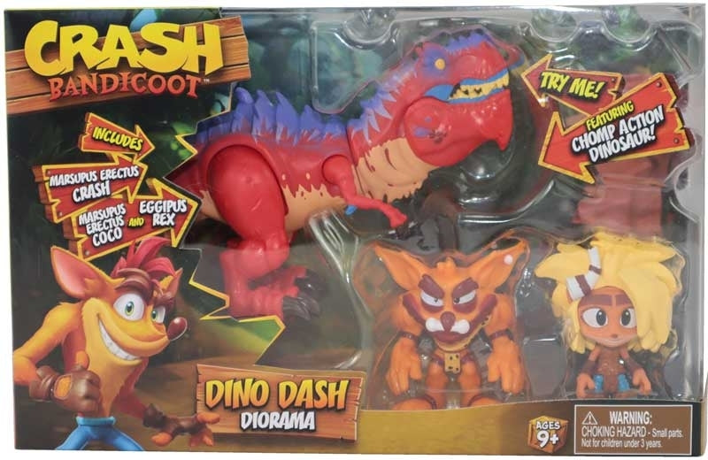 Toy package featuring Crash Bandicoot and a dinosaur with figures and text on the packaging.
