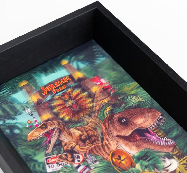 Framed artwork of dinosaurs with 'Jurassic Park' text in a jungle setting.