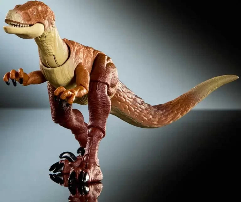Toy dinosaur figure on a reflective surface with a gradient background