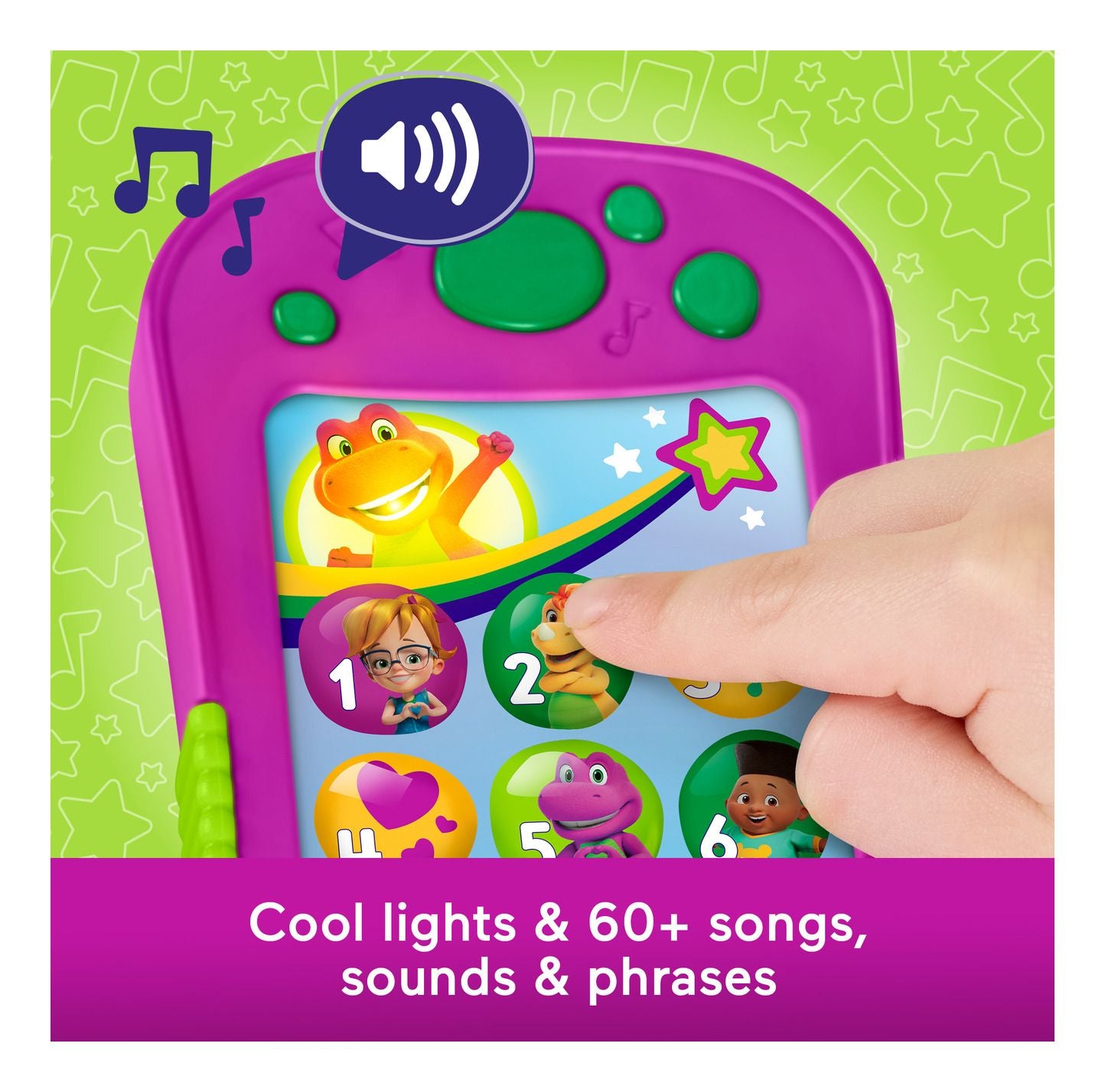 Children's educational toy with colorful display and hand interacting with it on a green background.