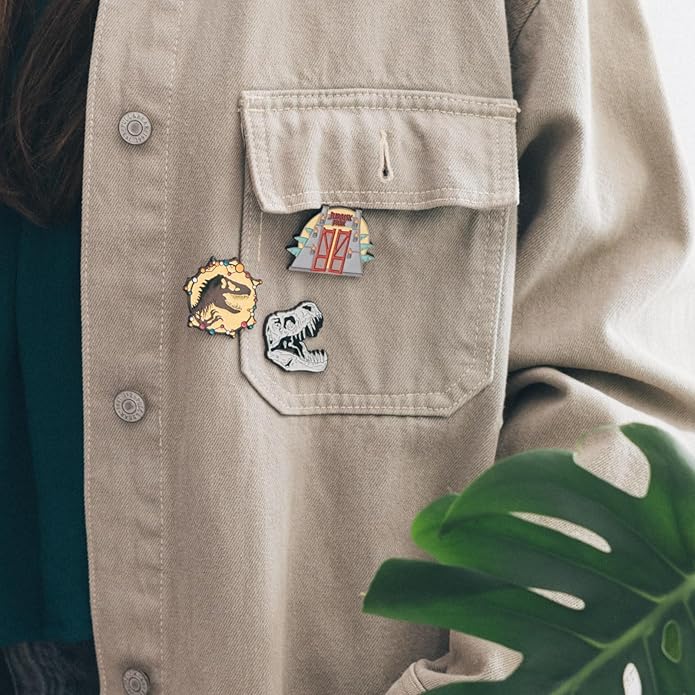 Beige jacket with decorative pins on a neutral background