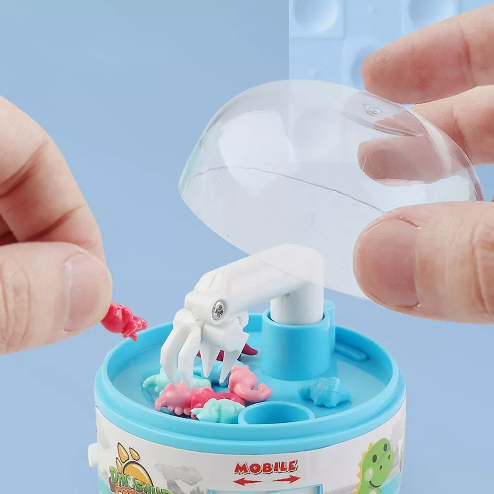 mini dino claw machine on a white background